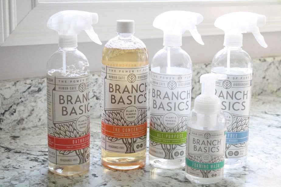 toss the toxins in 1 easy step with branch basics cleaners starter kit on kitchen counter includes bathroom cleaner concentrate all purpose cleaner foaming wash and streak free cleaner