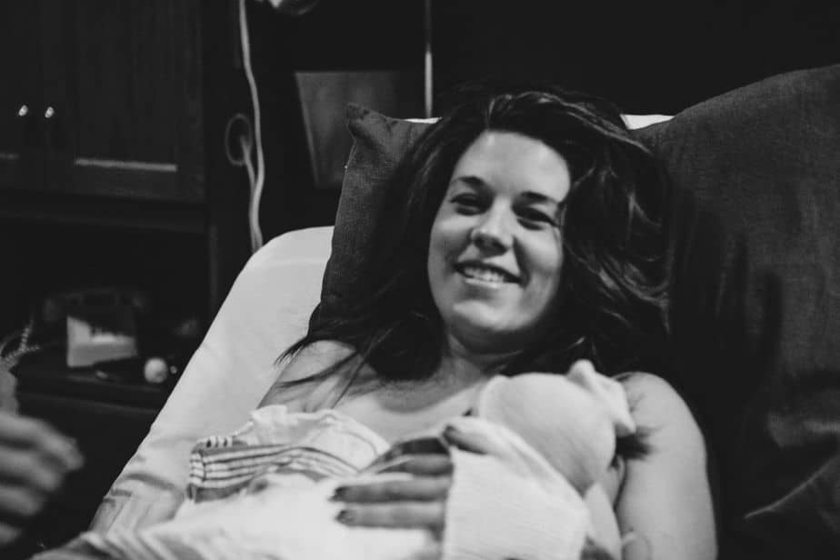 Woman in hospital holding her baby, a positive vbac birth story