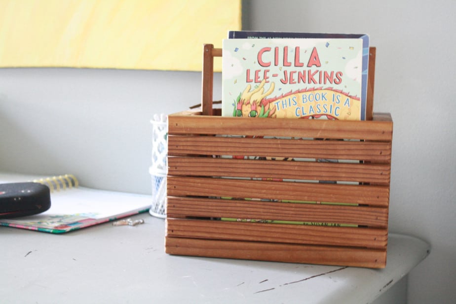 book basket on child's desk featuring book cilla lee-jenkins to help develop your child's love of reading