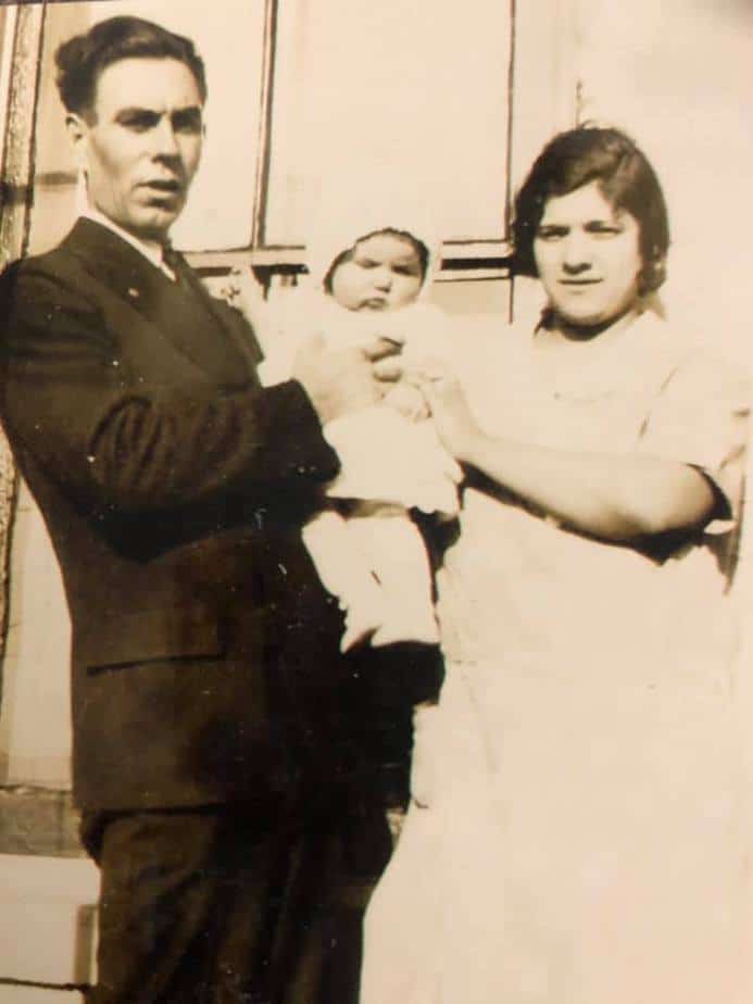 Old photo of grandpa, grandma, and baby that made the best authentic Italian pizzellas.