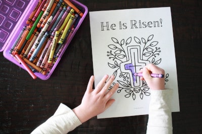 Child coloring He is Risen coloring page with cross and leaves for Christ centered activity.