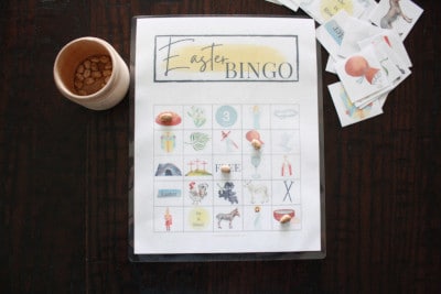 Christ centered Easter Bingo game displayed on kitchen table with dry beans as markers.
