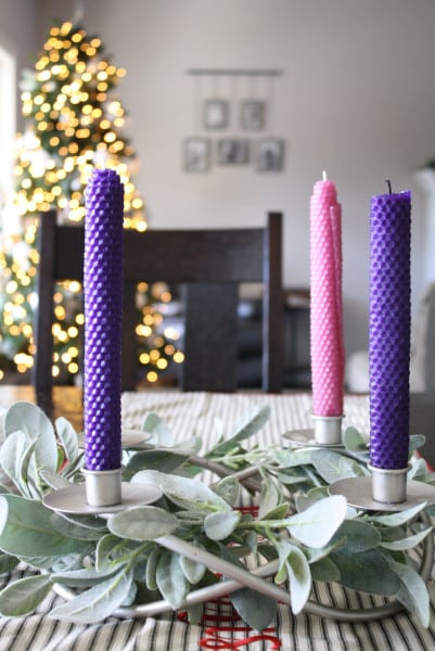 Hand rolled beeswax Advent candles displayed on kitchen table in an Advent wreath.