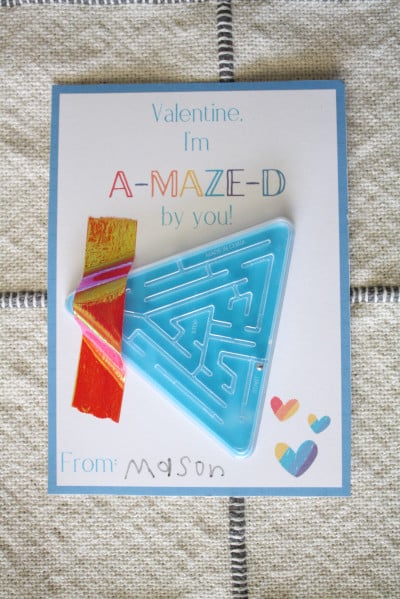 Maze valentine assembled and displayed on kitchen table for one of the free printable valentines cards for kids.