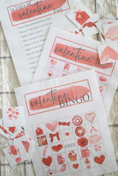 Free Valentine printable bundle displayed on kitchen table.