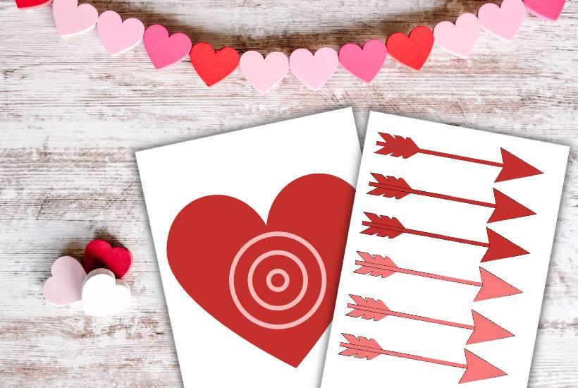Pin the arrow on the heart game with pink and red arrows.